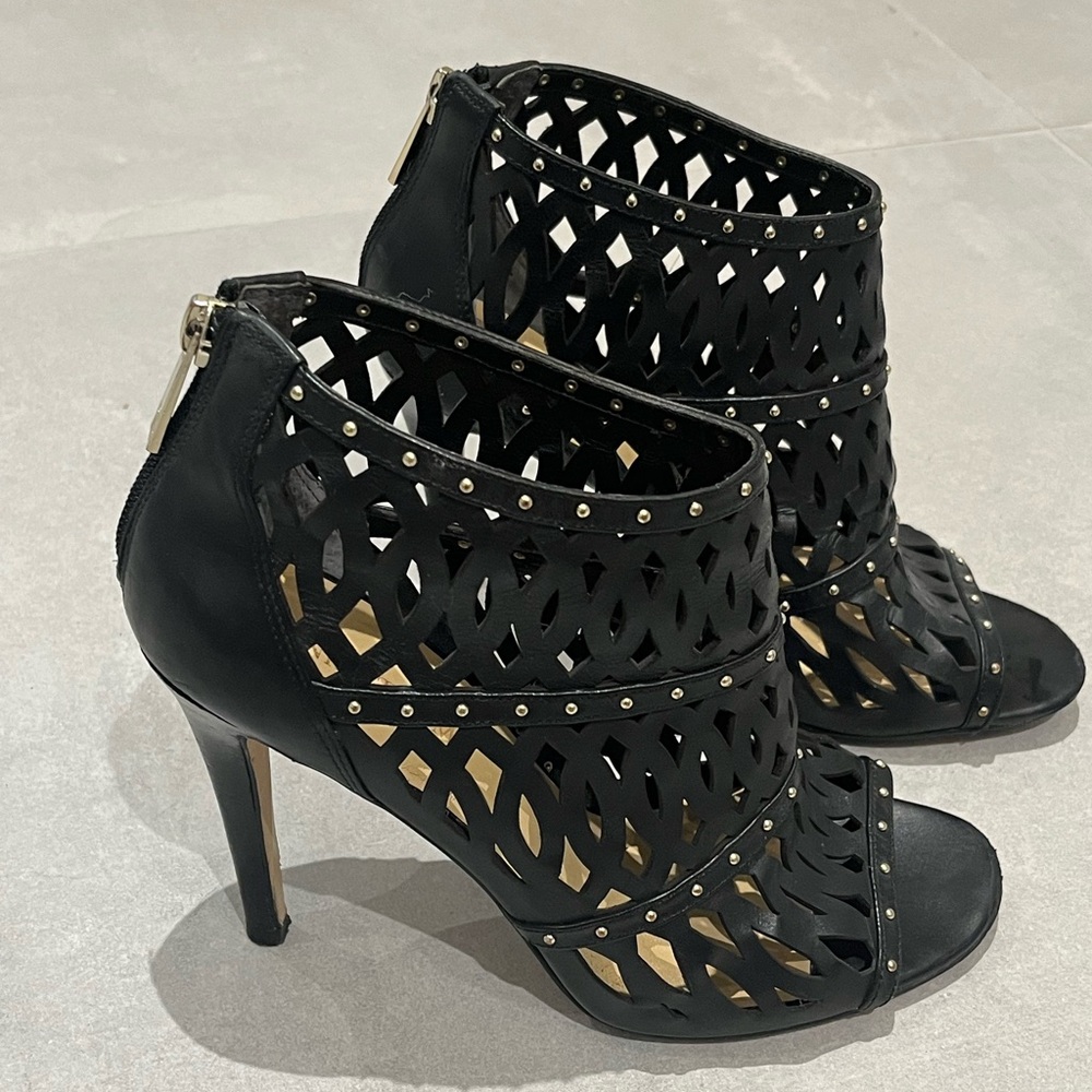 Black cage stiletto heels with gold stud accents. Ivanka Trump US 8.5